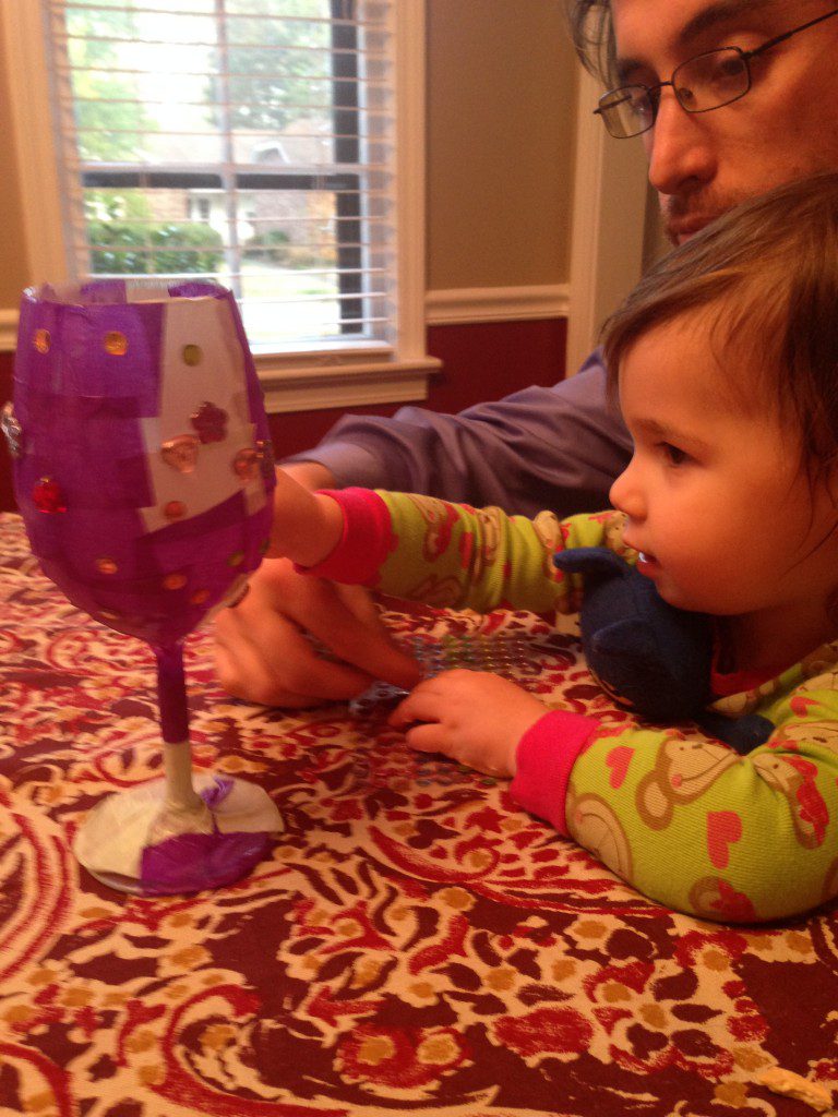 Nora and Daddy decorating Elijah's Cup