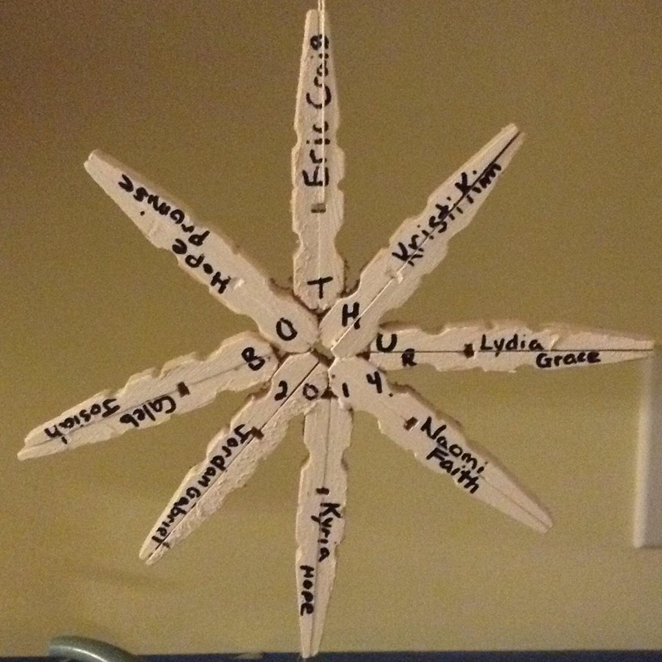 snowflake ornament with names of family members, in Heaven and on Earth.